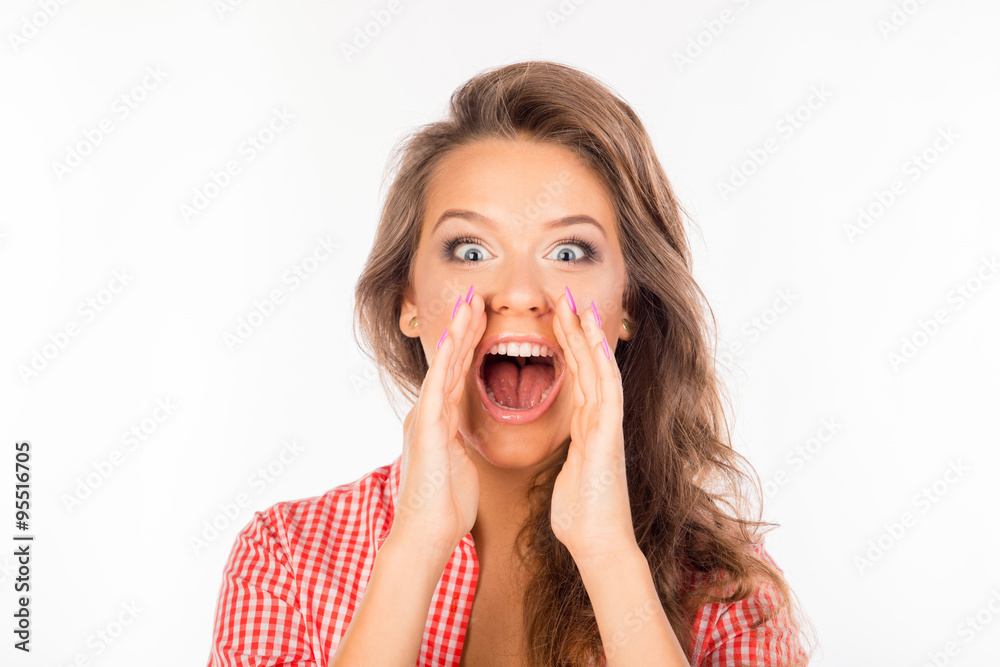 Cheerful young woman in shirt holding hands near mouth shouting Cheerful young woman in shirt holding hands near mouth shouting