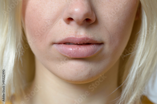 Fotografia Lips and Nose of a Young Blond Woman