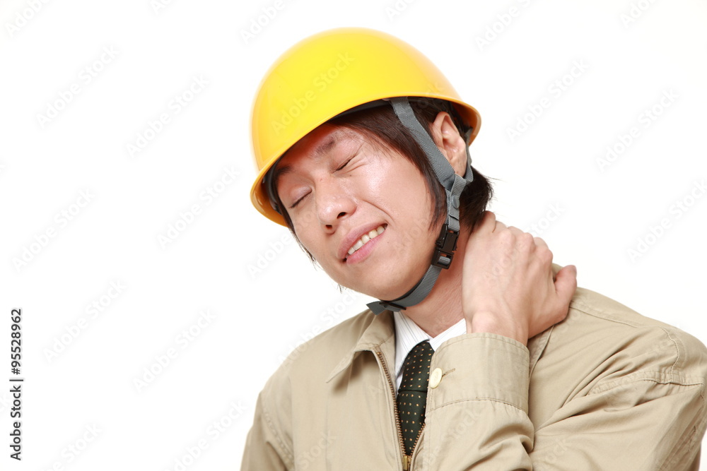 Japanese construction worker suffers from neck ache Japanese construction worker suffers from neck ache