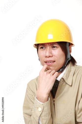 perplexed construction worker