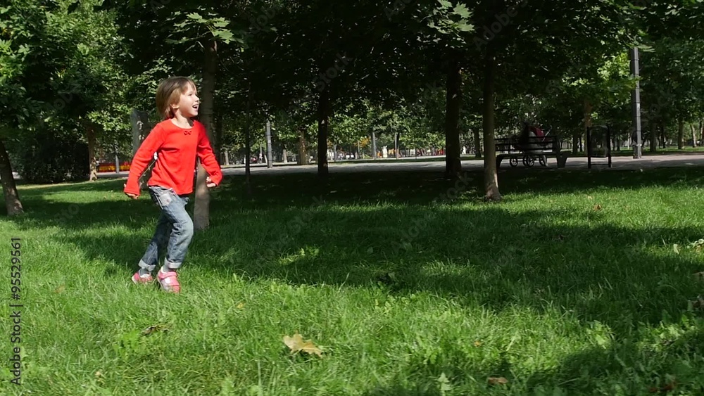 little beautiful girl outside in nature on a summer day. Slow motion little beautiful girl outside in nature on a summer day. Slow motion