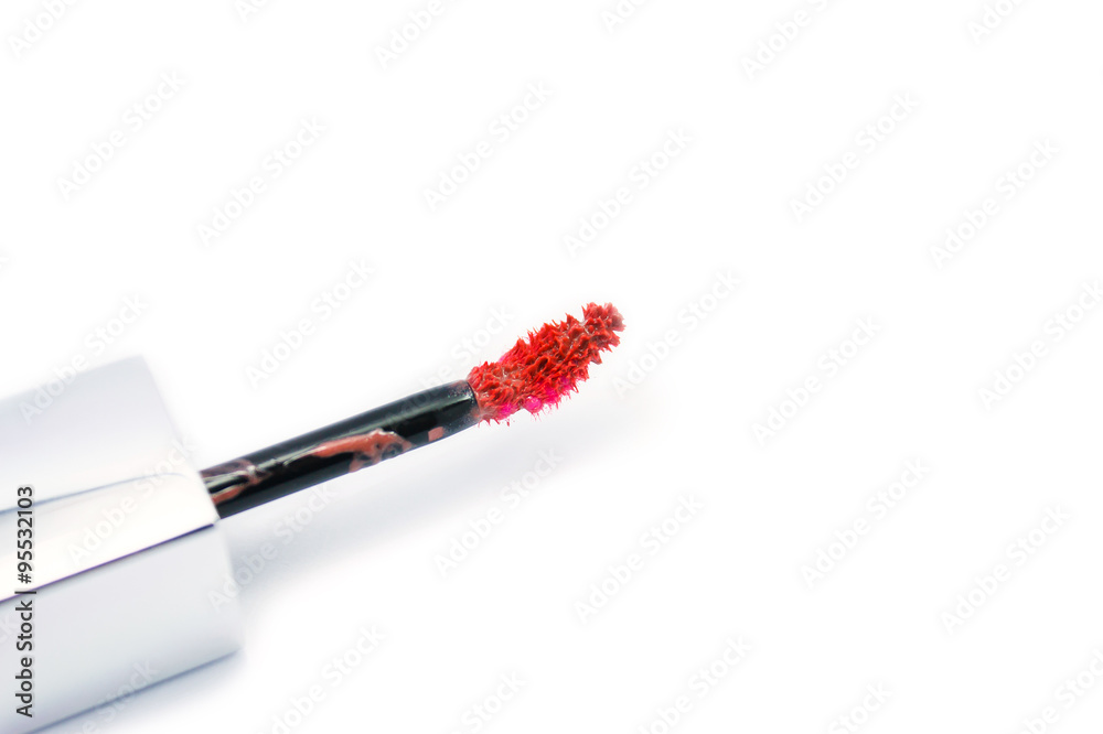 beautiful lip gloss brush, isolated on white beautiful lip gloss brush, isolated on white