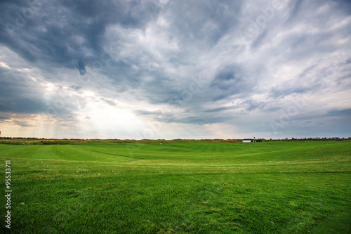 Sunset over the golf course, luxury green field at the golf club