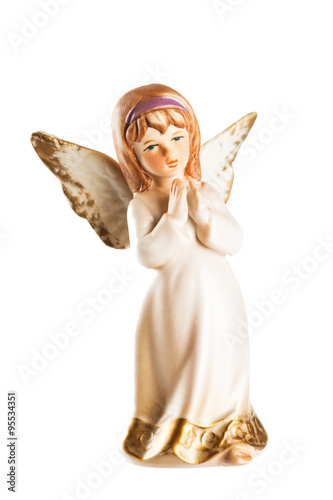 Christmas angel toy with crossed hands isolated on white backgro photo