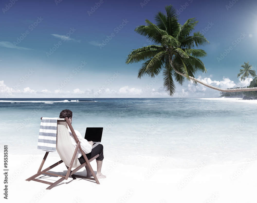 Businessman Working on a Tropical Beach Concept