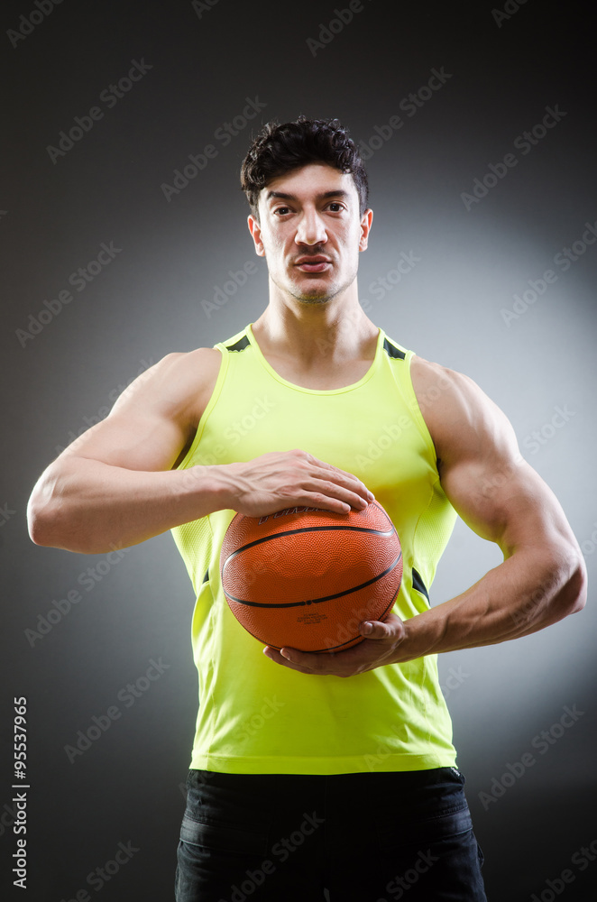 Muscular basketball in sports concept Muscular basketball in sports concept