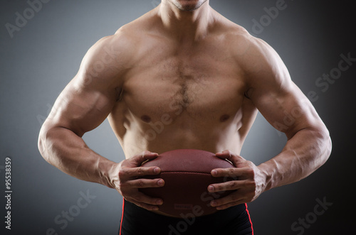 Muscular man with american football