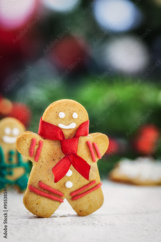 Christmas gingerbread  men cookies on white wooden board with copy space