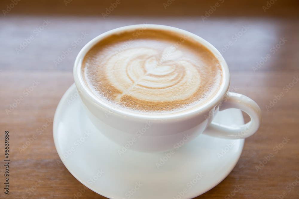 art latte coffee on white cup art latte coffee on white cup