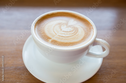 art latte coffee on white cup