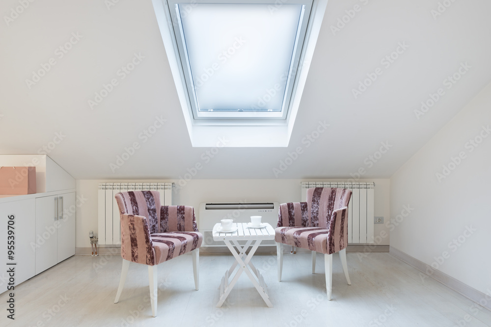 Fototapeta premium Attic converted to living space with large roof window