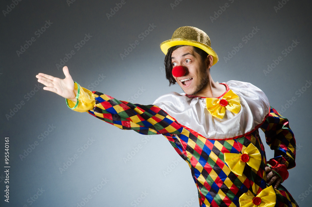 Funny clown against dark background Funny clown against dark background