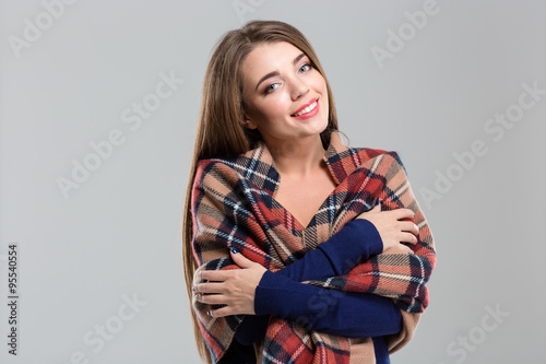 Happy charming woman with plaid