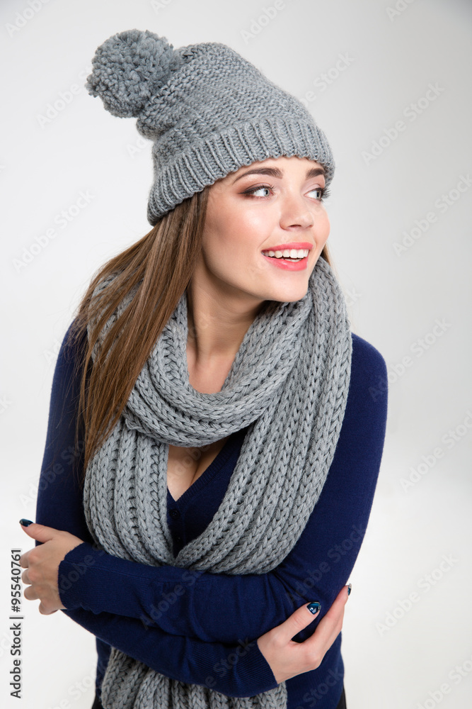 Smiling woman in winter cloth looking away Smiling woman in winter cloth looking away