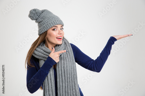 Smiling woman showing copypace on the palm photo