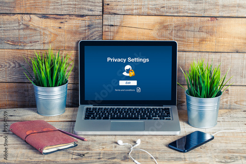 Privacy settings in a laptop screen. Workplace setting.