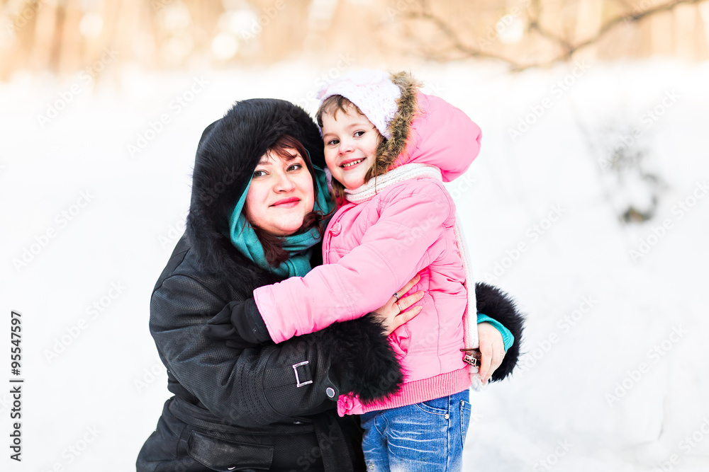mother with her daughter in winter park mother with her daughter in winter park