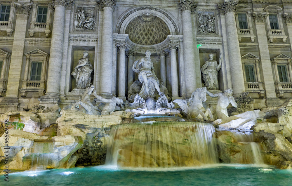 Rome, the fountain of Trevi in evening illumination