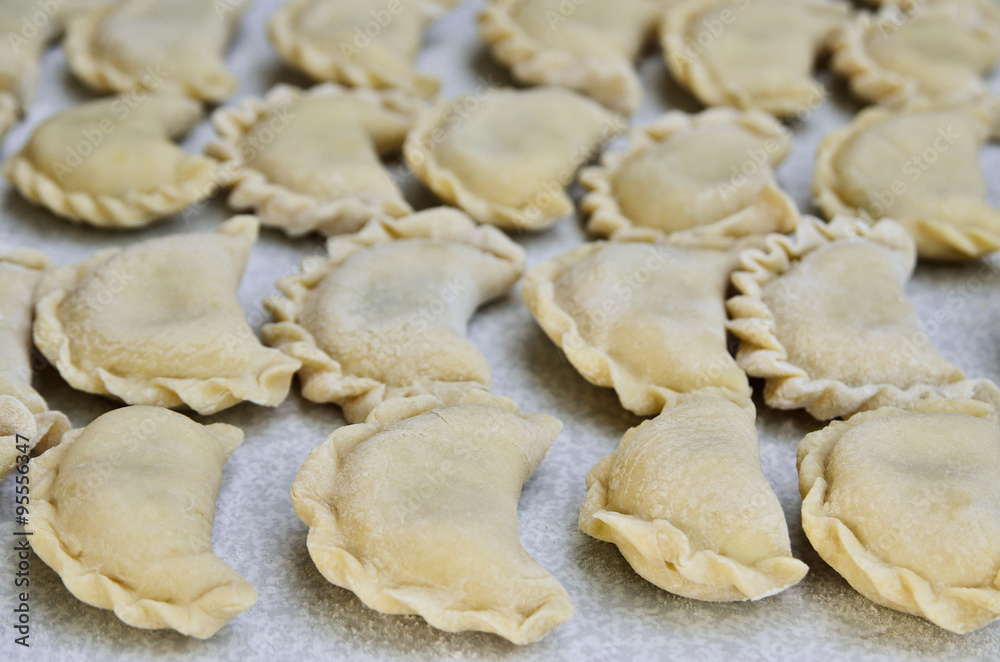 Cheese ravioli lie on the kitchen table Cheese ravioli lie on the kitchen table