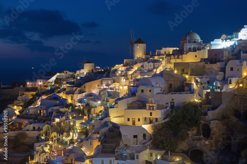 Santorini - The look to part of Oia with the windmills at dusk.