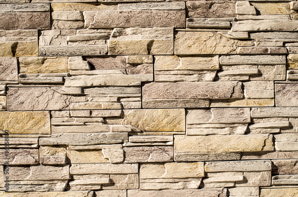 Decorative relief cladding slabs imitating stones closeup Decorative relief cladding slabs imitating stones closeup