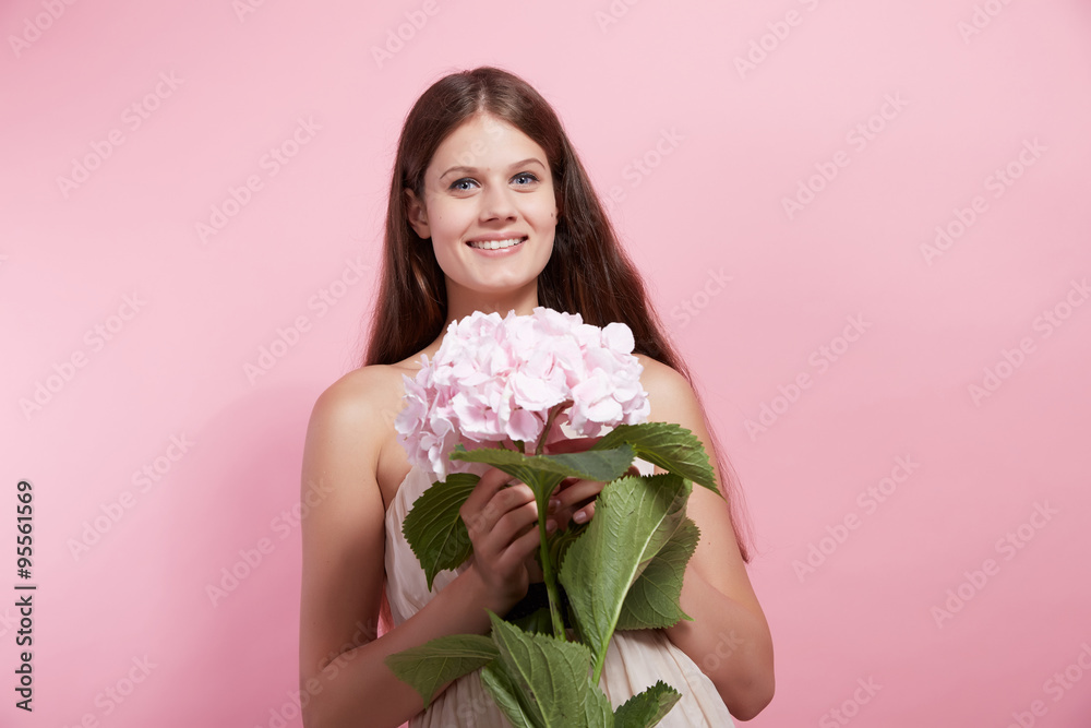 beautiful girl with flowers in studio