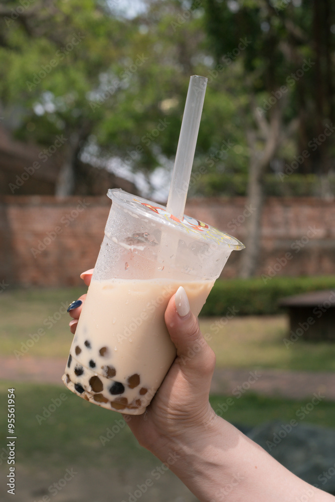 Woman Holding A Bottle Of Taiwanese Bubble Boba Milk Tea タピオカミルクティーを持つ女性 Stock Photo Adobe Stock