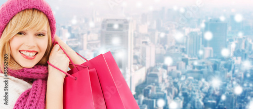 smiling young woman with shopping bags