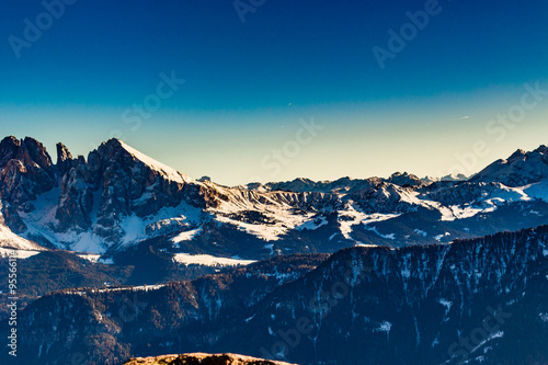 panorama of the Dolomites with snow-capped peaks and conifers © Vivida Photo PC
