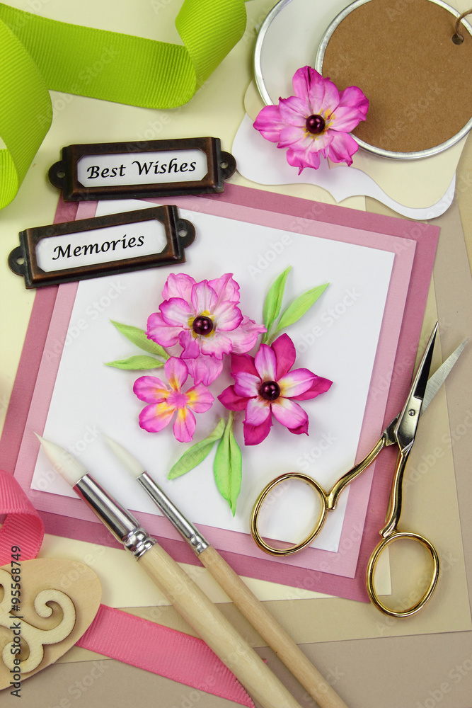 Handmade greeting card and assorted scrapbooking or card making tools and  materials Stock Photo