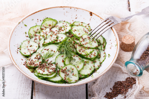   Cucumber salad with flax seeds.selective focus