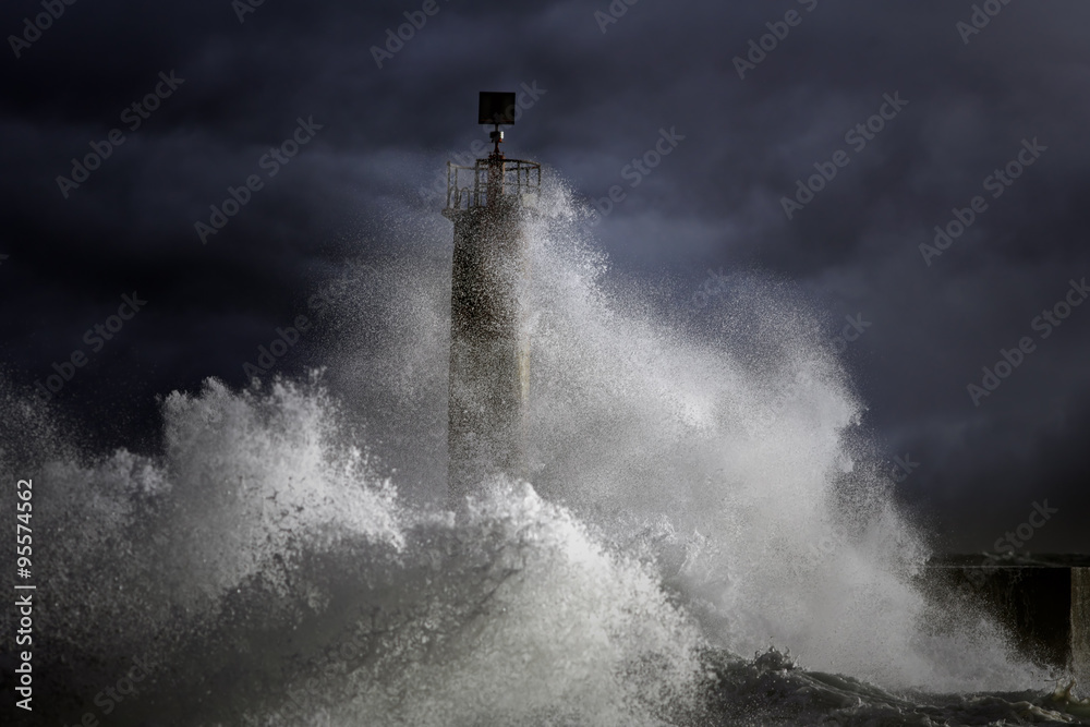 Fototapeta Stormy waves over lighthouse