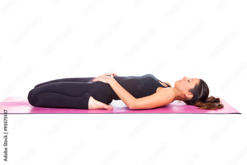 Beautiful woman doing Supta Virasana pose Beautiful woman doing Supta Virasana pose