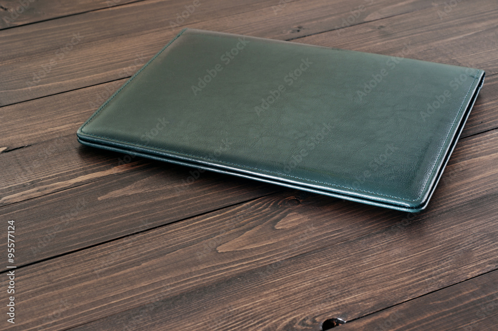Business leather folder on the office desktop Business leather folder on the office desktop