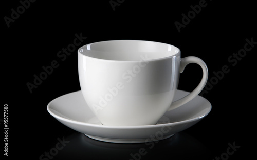 Glass. White empty coffee cup isolated on black background