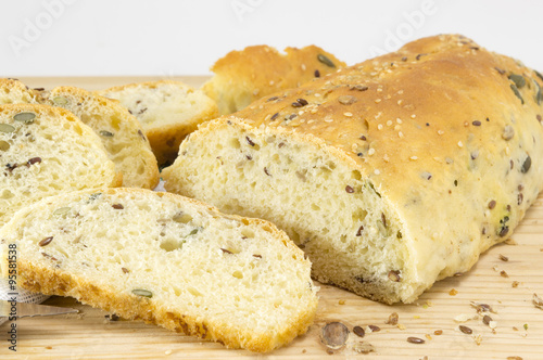 Sliced homemade bread with seeds on the table