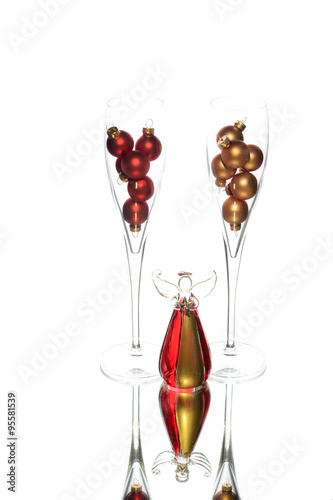 Two glasses with Christmas angel decoration reflection