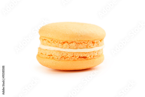 Tasty orange macaron isolated on white