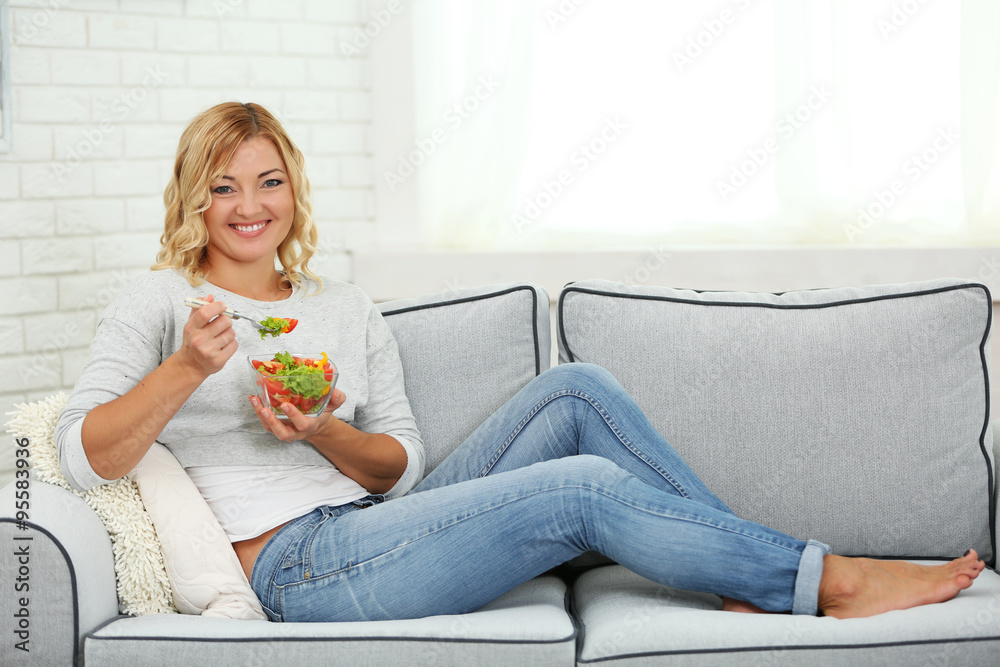 Beautiful woman with salad on home interior background Beautiful woman with salad on home interior background