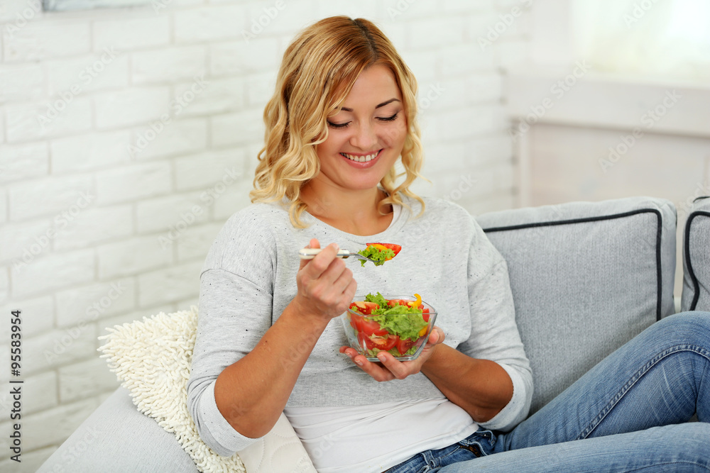 Beautiful woman with salad on home interior background Beautiful woman with salad on home interior background