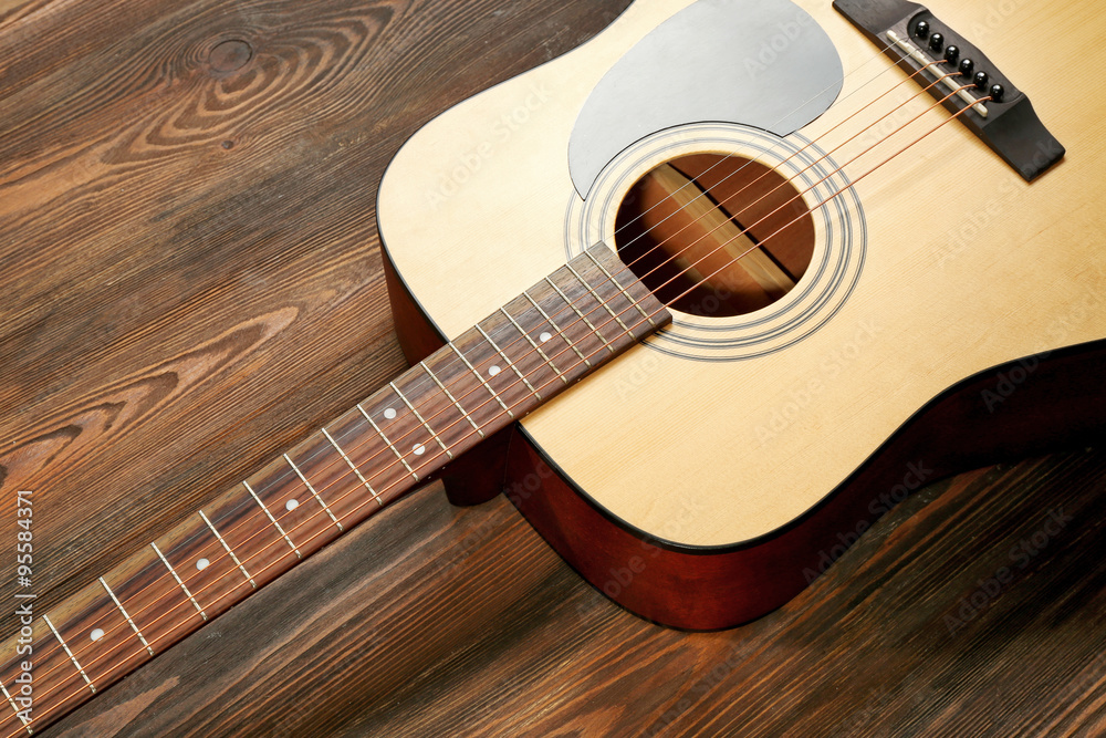 Fototapeta premium Guitar on wooden background