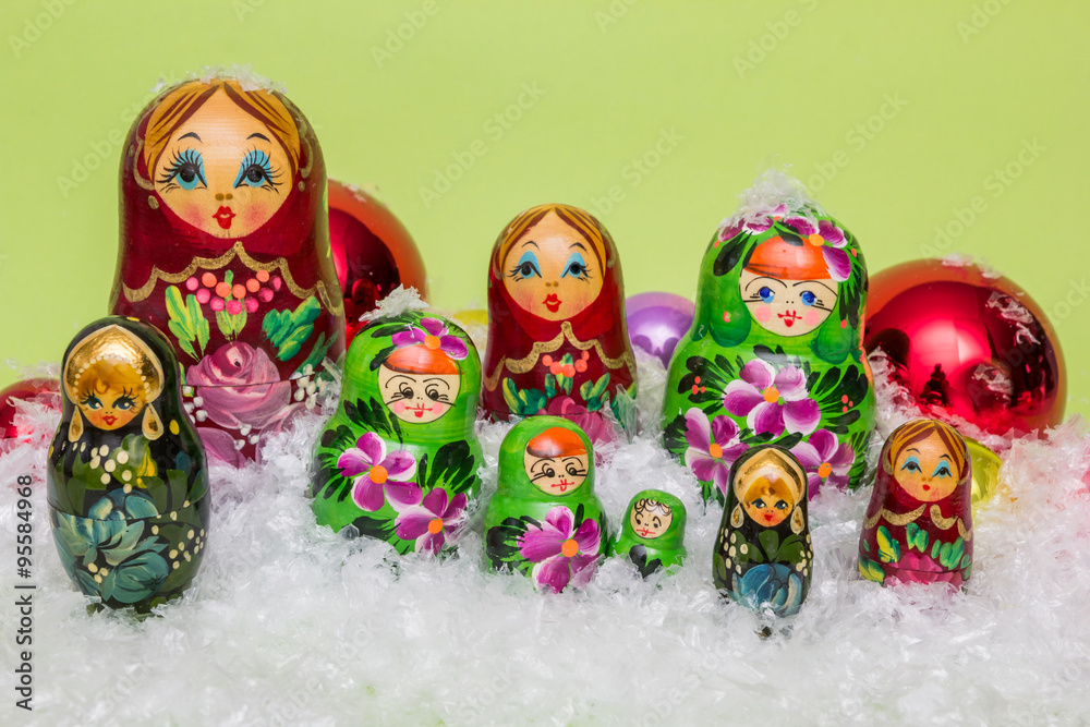 Russian wooden dolls with snow and Christmas balls Russian wooden dolls with snow and Christmas balls