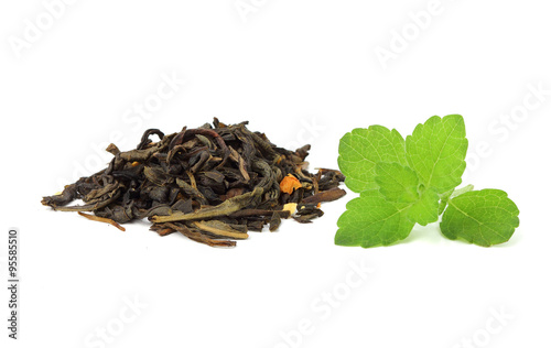 Dried leaves of green tea with a sprig of mint.