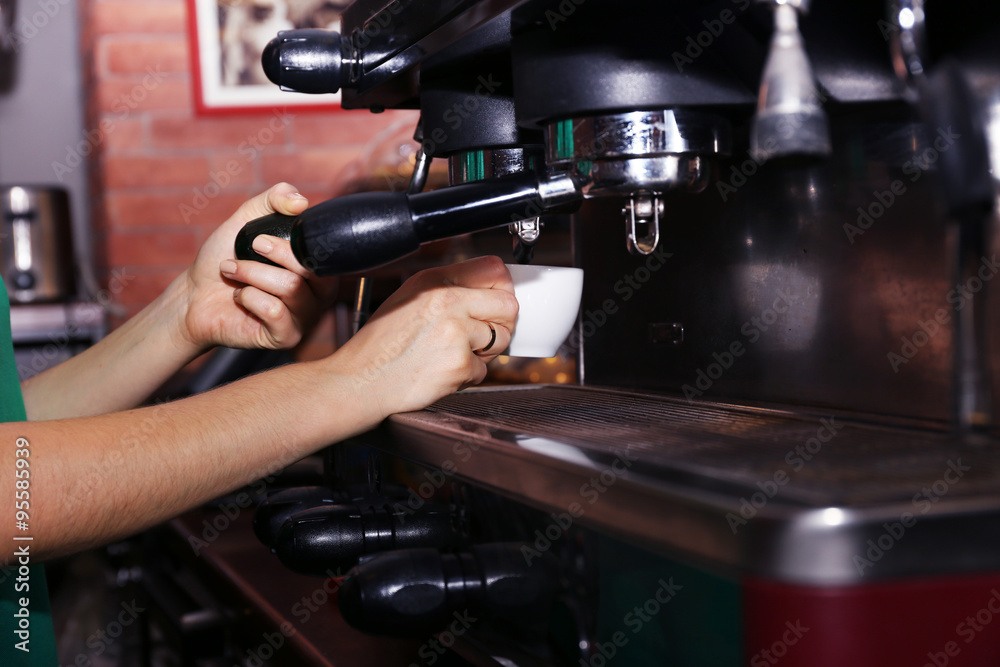 Fresh coffee making in the professional coffee machine, close up