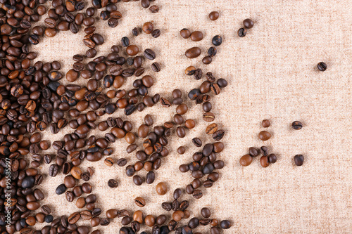 Roasted coffee beans on the linen fabric