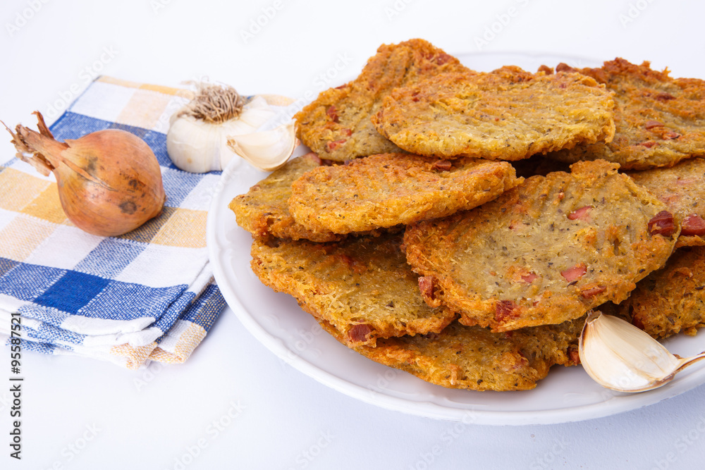Fried potato pancakes on white plate Fried potato pancakes on white plate