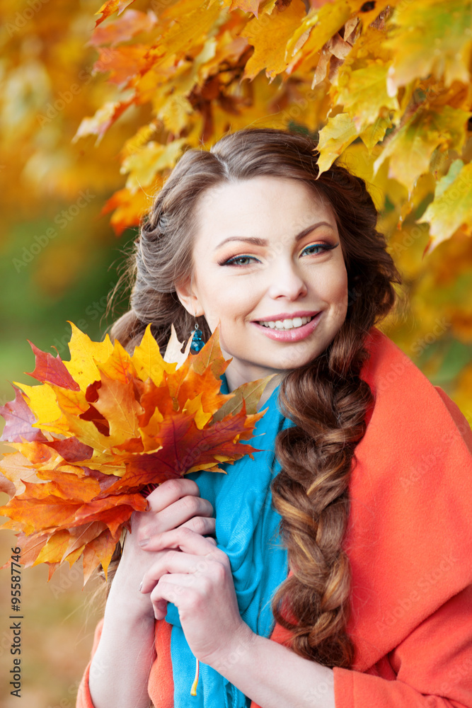 Autumn model, bright make up. woman on background fall landscape Autumn model, bright make up. woman on background fall landscape