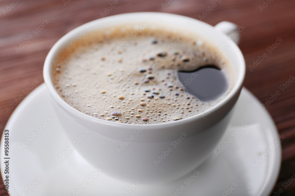 Cup of coffee on wooden background Cup of coffee on wooden background