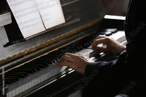Close up of man hands piano...