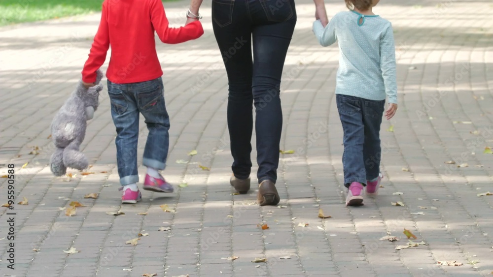 Happy Family on a Walk in Summer. Child with Parents Together Happy Family on a Walk in Summer. Child with Parents Together
